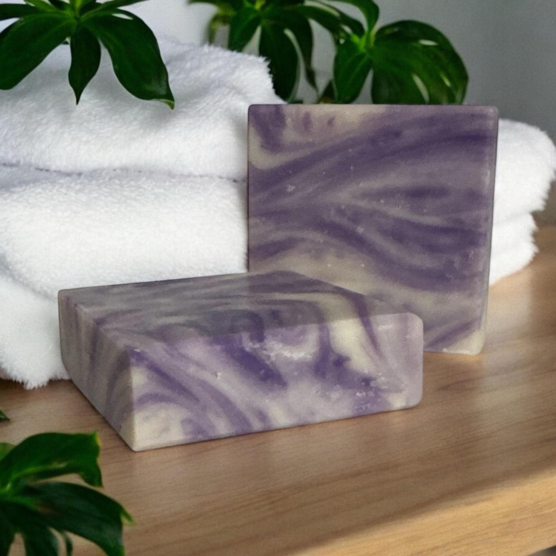 Handcrafted Lavender Bliss Soap bar with natural ingredients, including coconut oil, shea butter, and olive pomace oil, beautifully presented with a soothing lavender scent, perfect for a calming skincare experience